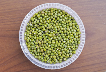 Green beans with wood background