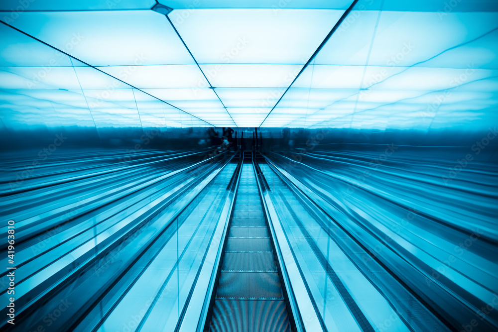 Wall mural moving escalator in modern building