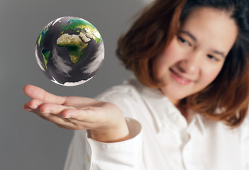 the earth globe in hand