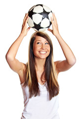 smiling happy young girl playing soccer