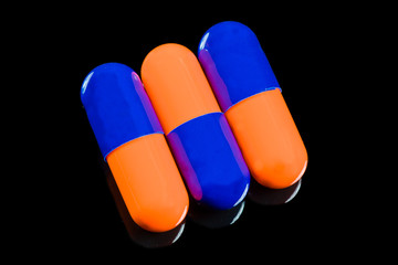 pills on black background