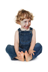l&auml;chelndes Kind im Jeans-Anzug
