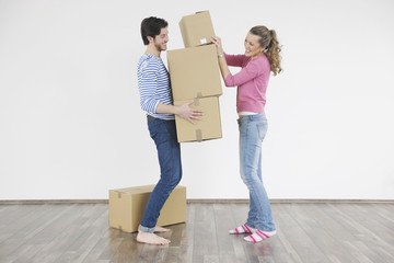 Fototapeta na wymiar Young couple moving in new home