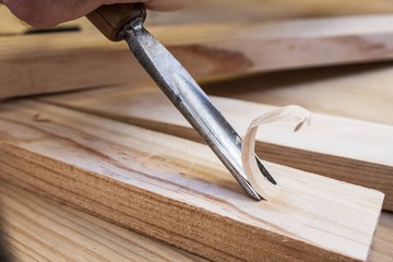 gouge wood chisel carpenter tool working wooden background