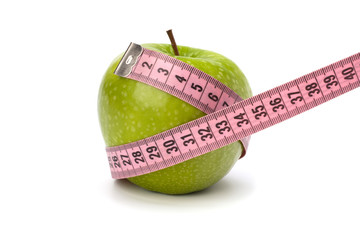 Apple with tape measure. Healthy lifestyle concept.