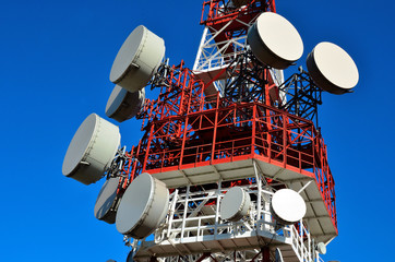 antenna tower transmissions in the blue sky