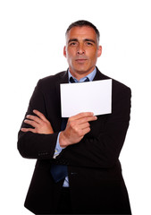 Mature business man holding a white card