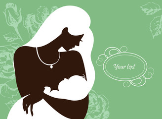 Beautiful mother silhouette with baby