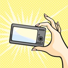 Illustration of a female hand holding a photo camera