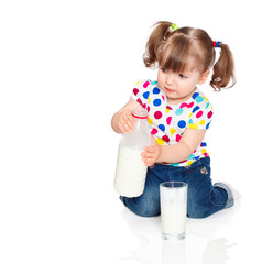 little girl pours milk