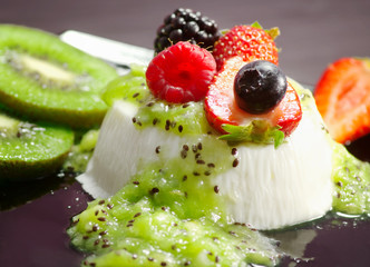 delicious panna cotta with kiwi and berries