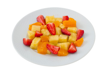 fruit salad on the plate and glass of water