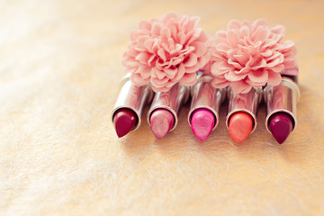 glamour lipsticks and flower petals