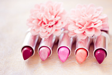 glamour lipsticks and flower petals