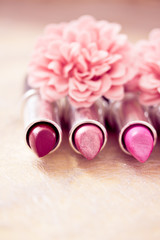 glamour lipsticks and flower petals