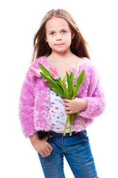 little girl with bouquet of pink tulips isolated on white