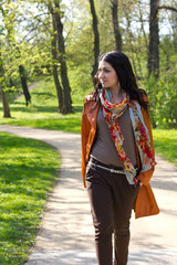 Fototapeta premium Young woman walking in a park