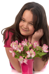 Asian miling girl at the age of twelve with pink flowers