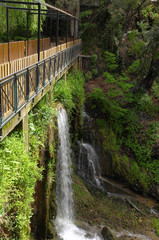 Footbridge over a waterfall.