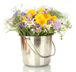 beautiful bouquet of bright  wildflowers in bucket, isolated