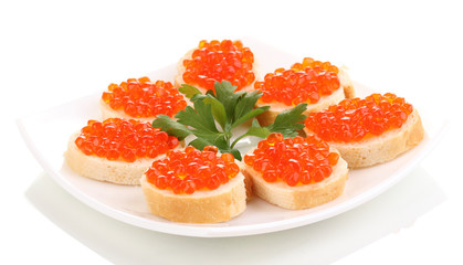 Red caviar on bread on white plate isolated on white