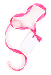 Blank gift tag with pink satin bow and ribbon isolated on white
