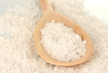 Sea salt with wooden spoon close-up