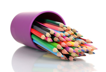 Naklejka premium Color pencils in glass isolated on white