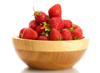 sweet ripe strawberries in wooden bowl isolated on white