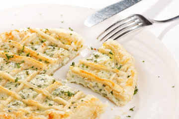 tasty quiche with cheese and herbs