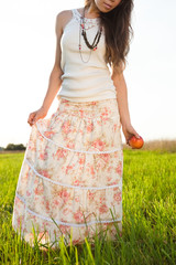 young woman in long skirt and tank top
