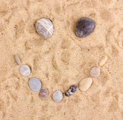 Smile-stones on sand
