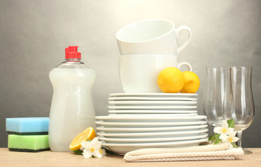 empty clean plates, glasses and cups with dishwashing liquid,