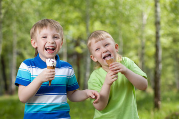 young children eating a tasty ice cream outdoor