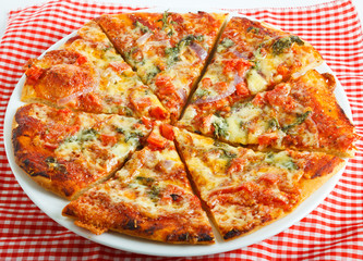 Homemade round pizza on plate