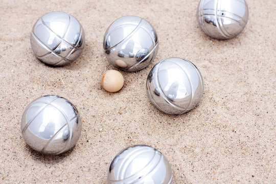 Game of jeu de boule, silver metal balls in sand