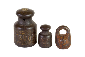 Three of the old weights for scales