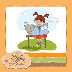 young sweet girl reading a book