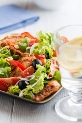 Chicken Salad (glass of water with lemon in the foreground)