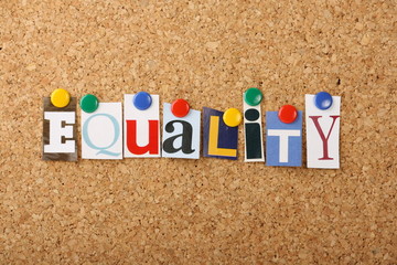 The word equality in magazine letters pinned to a cork board