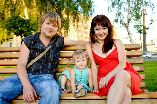 young family relaxing in the park