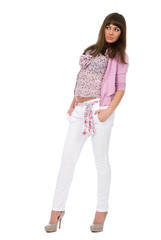 Young sexy brunette woman in pink shirt and white jeans