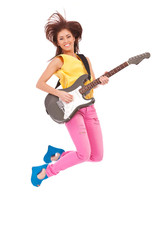 passionate woman guitarist jumps in the air
