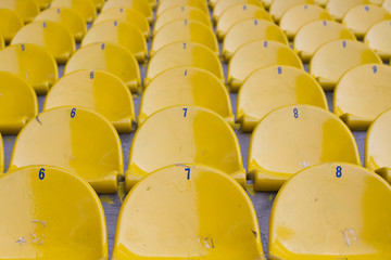 Naklejka premium Empty yellow stadium seats, Texture and Background