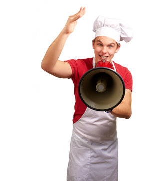 portrait of happy cook man shouting using megaphone over white b