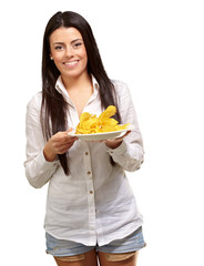 portrait of young woman holding a potato chips plate over white