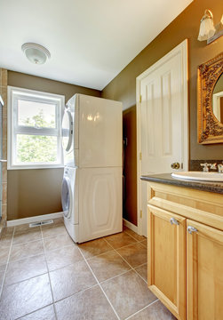 Laundry room with bathroom cabinet and sink.