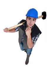 Man with sledge-hammer thinking