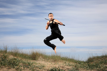 man with a crowbar jumping