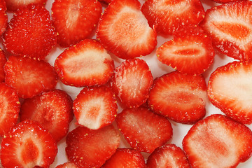 Background of the sliced ripe fresh strawberry